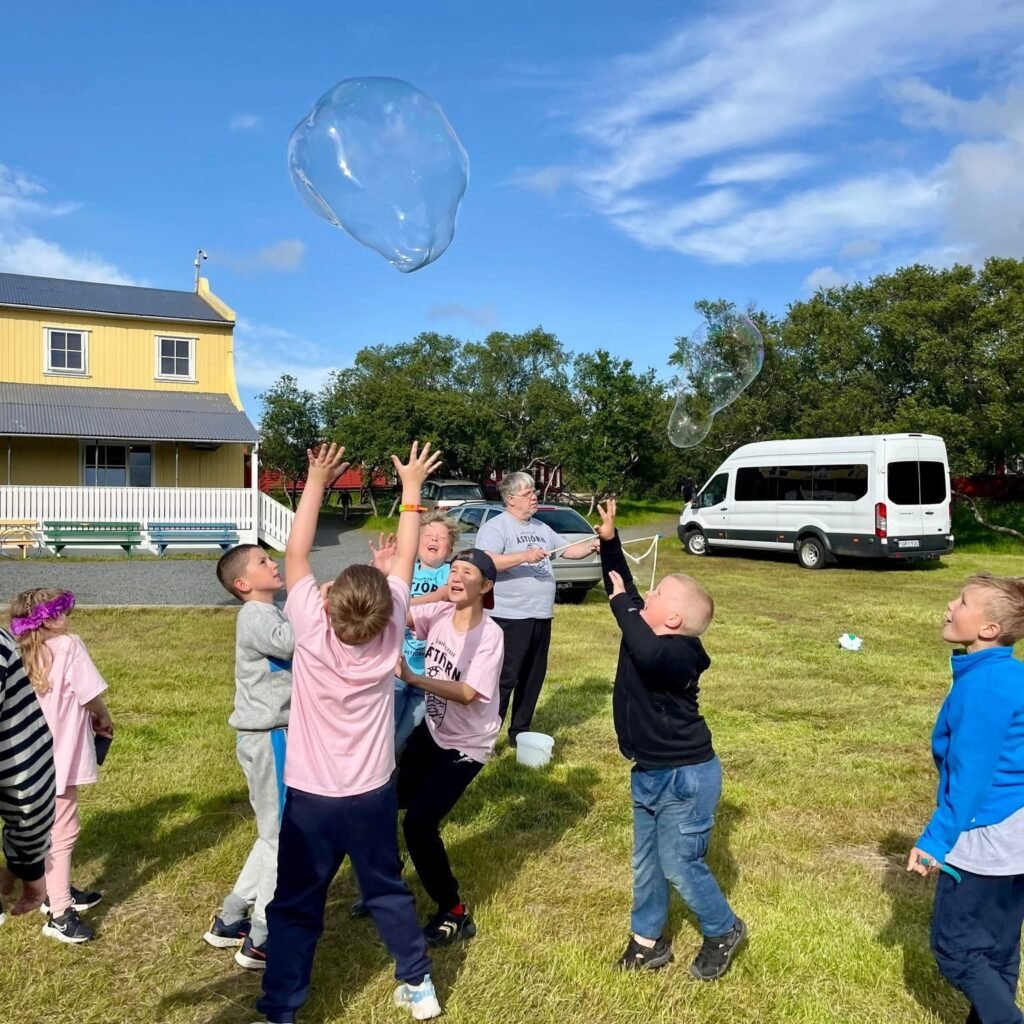 children playing with bubbles